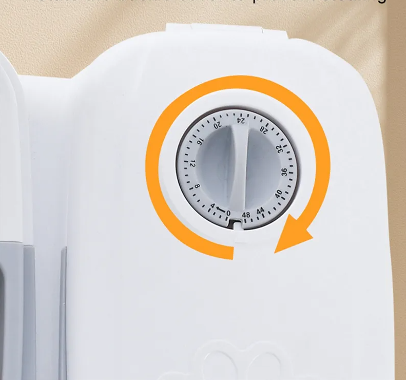 Automatic gray food dispenser for pets, ensuring fresh meals for cats and dogs.