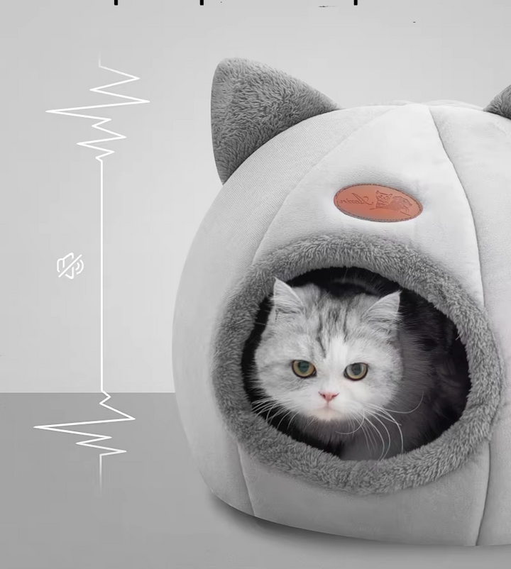 Black cat-shaped warming pet bed with soft, removable cushion for ultimate comfort.