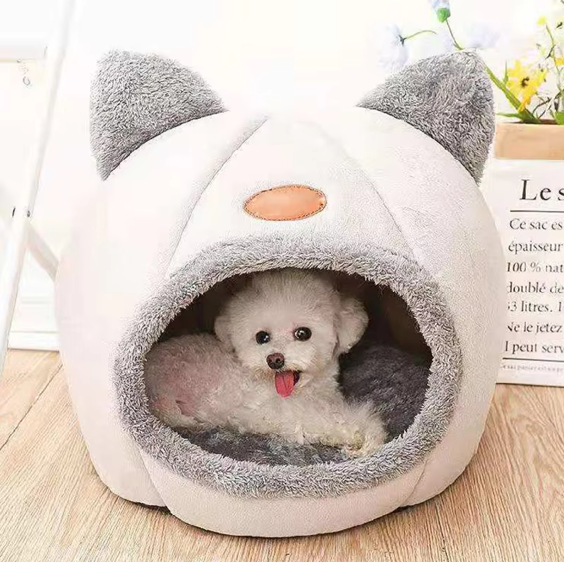 Cozy cat bed in cat shape with a plush, easily removable cushion for small pets.