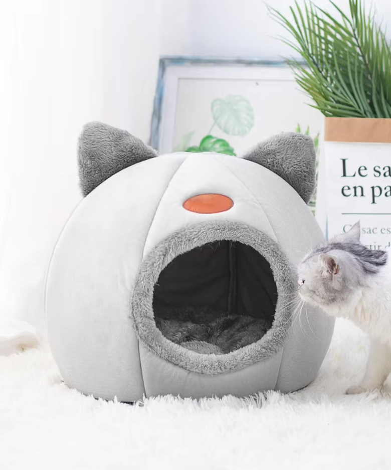 Soft gray cat-shaped pet house with a warming, removable cushion, ideal for cats.