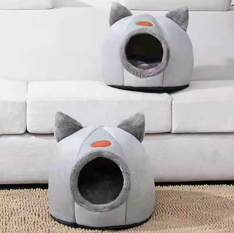 Small pet bed: gray cat-shaped design with a warm, removable inner cushion.