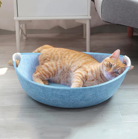 Gray felt cat bed with sturdy handles for easy carrying, a cozy pet furniture accessory.