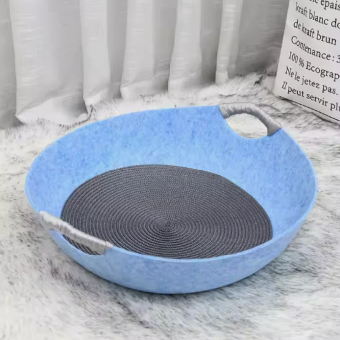 Portable blue felt cat bed designed for comfort, featuring convenient carrying handles.