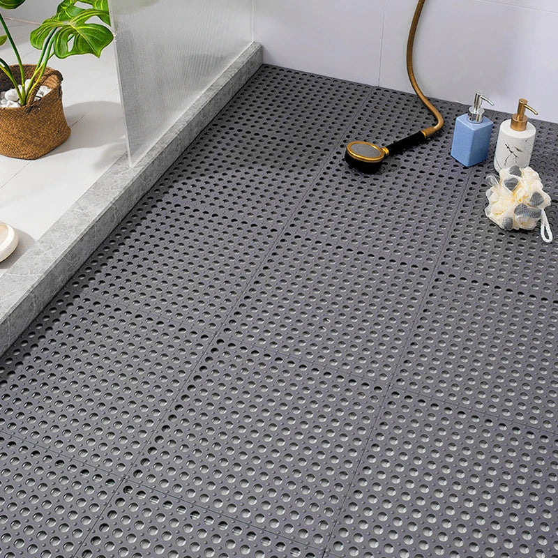 Gray non-slip shower mat set, quick-dry & mold resistant for bathroom safety. Interlocking tiles prevent slips.