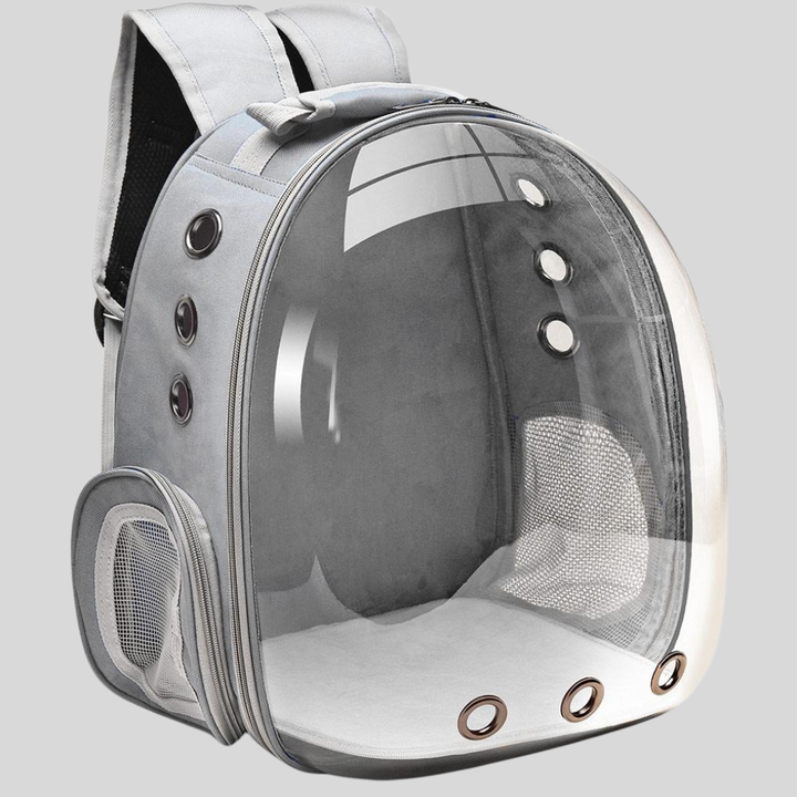 Close-up of the breathable mesh window on a red pet carrier backpack, essential pet supplies for outdoor use.