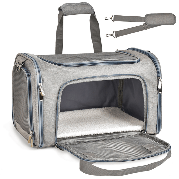 Pet carrier for dog travel, black soft-sided, airline compliant with mesh windows.