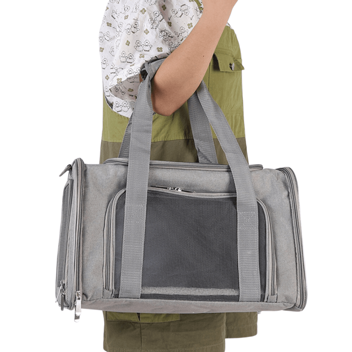 Soft-sided dog carrier in gray, perfect for airline travel and small to medium pets.