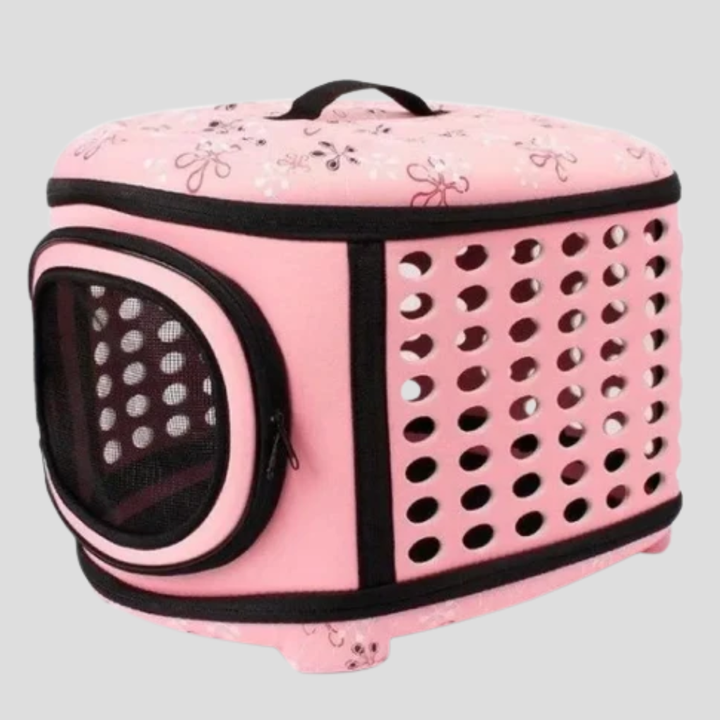 Pink ventilated pet carrier, ideal for cat travel with ample airflow and comfortable design