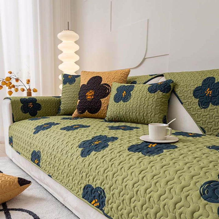 Close-up of green cotton non-slip sofa cover fabric texture for living room