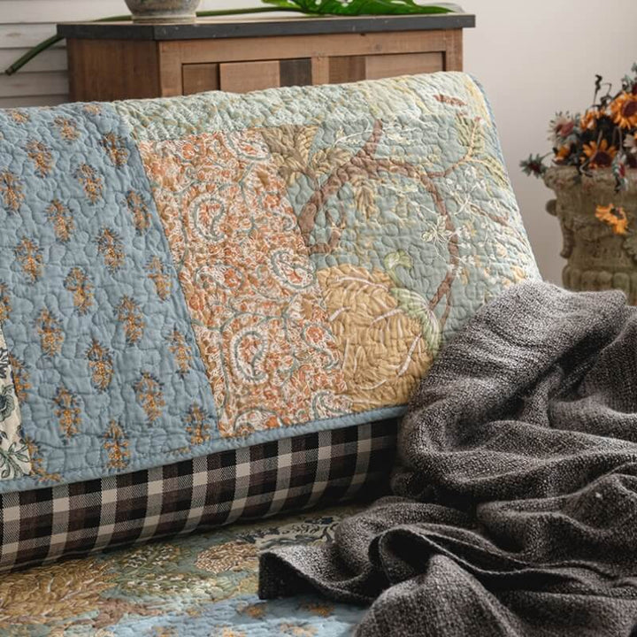 Non-slip green cotton couch cover with intricate floral design, perfect pet friendly addition.