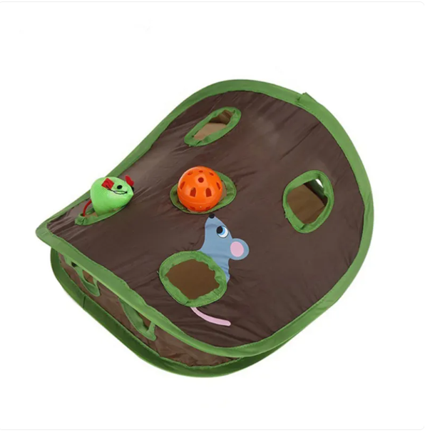A happy cat playing inside a green interactive pet tent, engaging with the hanging toys.