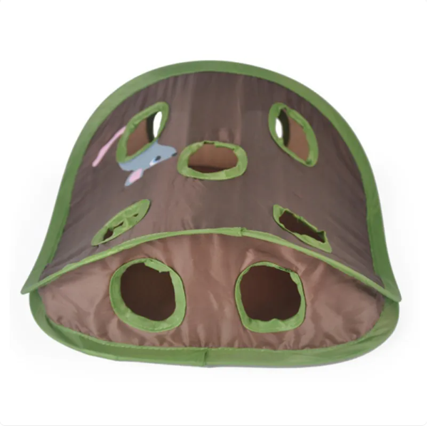 Detail of the interactive toys inside the green cat tent, designed for feline entertainment.