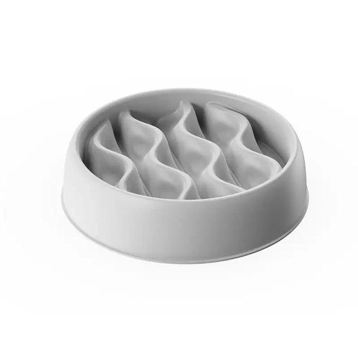 Happy dog eating from a paw print slow feeder bowl, designed for anti-gobble pet health