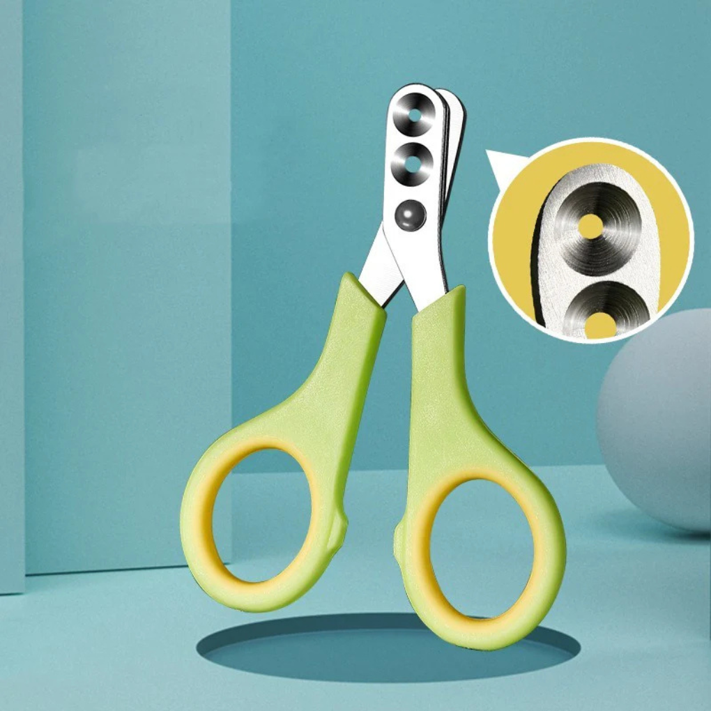 Green pet nail clippers with safety guard for cats & small animals, ideal for pet grooming.