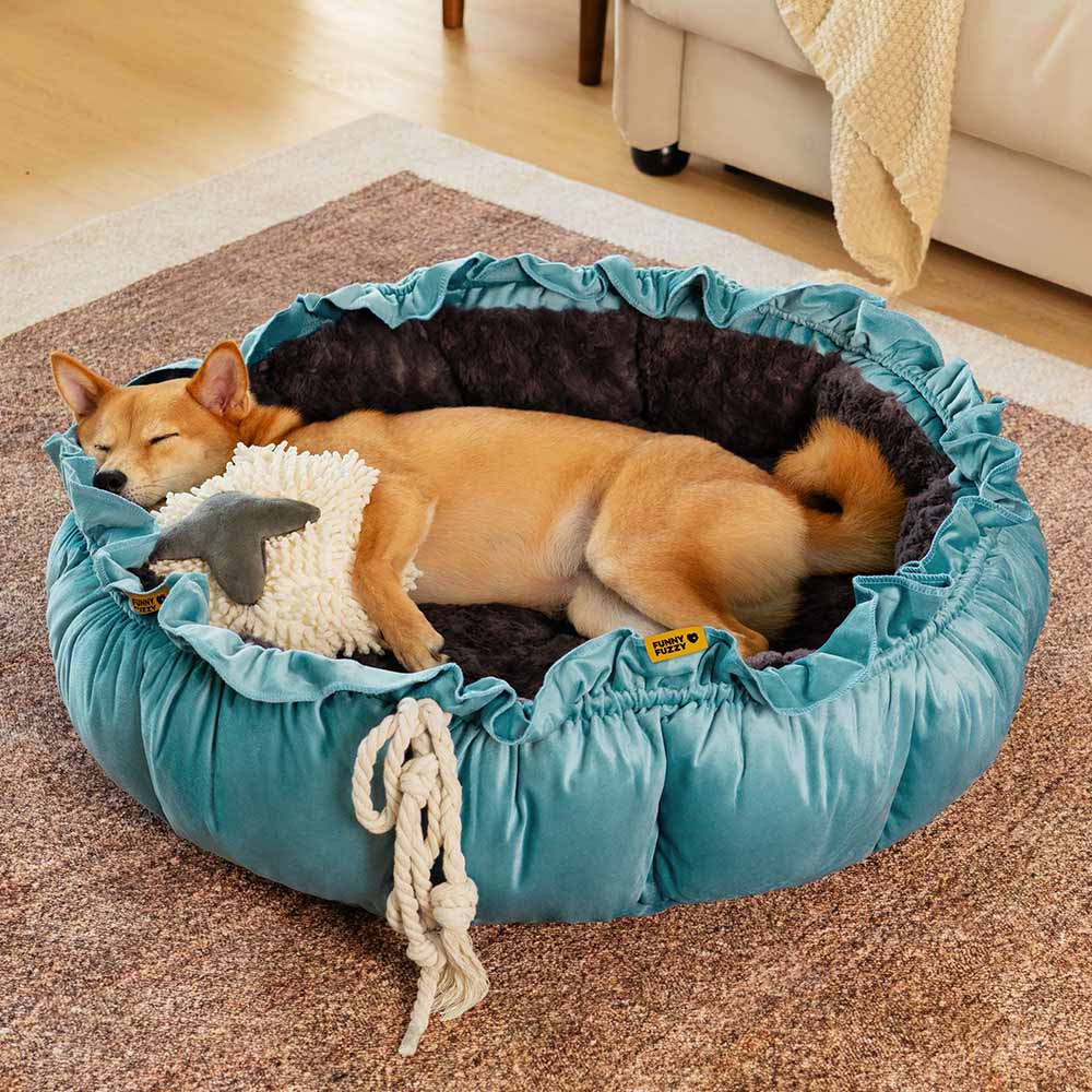 Blue calming dog bed, plush fabric, adjustable pet nest for optimal comfort.
