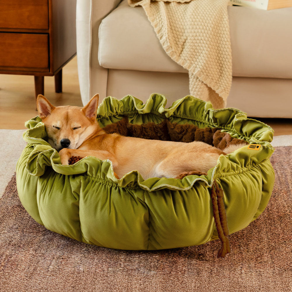Adjustable green plush dog bed, a cozy calming nest for anxious pets.