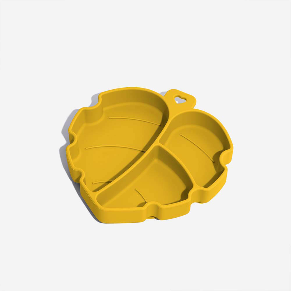 Green silicone pet bowl with leaf design and suction cup base for dogs, non-toxic