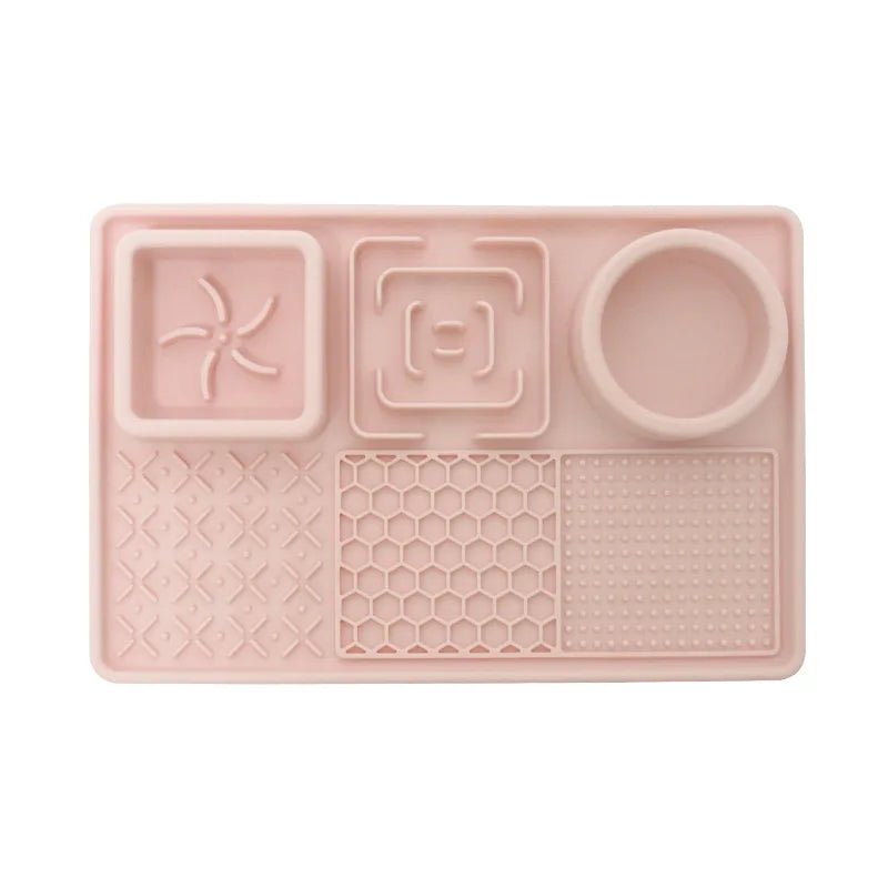 Orange pet slow feeder bowl and a calming licking mat for healthy eating and anxiety reduction