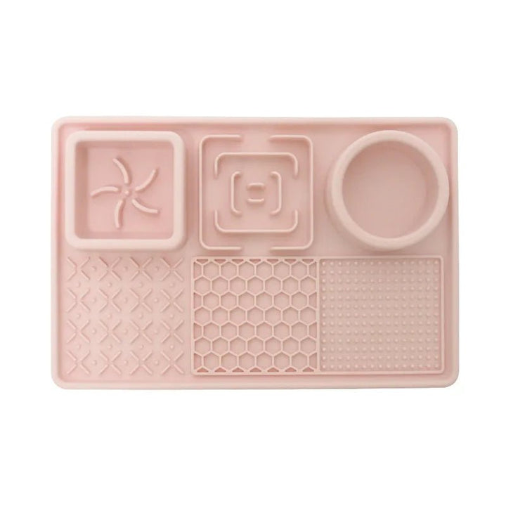Orange pet slow feeder bowl and a calming licking mat for healthy eating and anxiety reduction