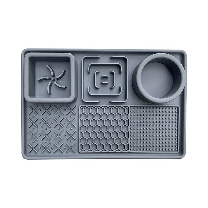 Set of pet accessories: a slow feeder dog bowl and a patterned licking mat, promoting healthy eating