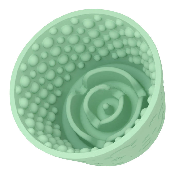 Pink pet slow feeder bowl with textured surface for licking, encouraging healthy eating and stress reduction.