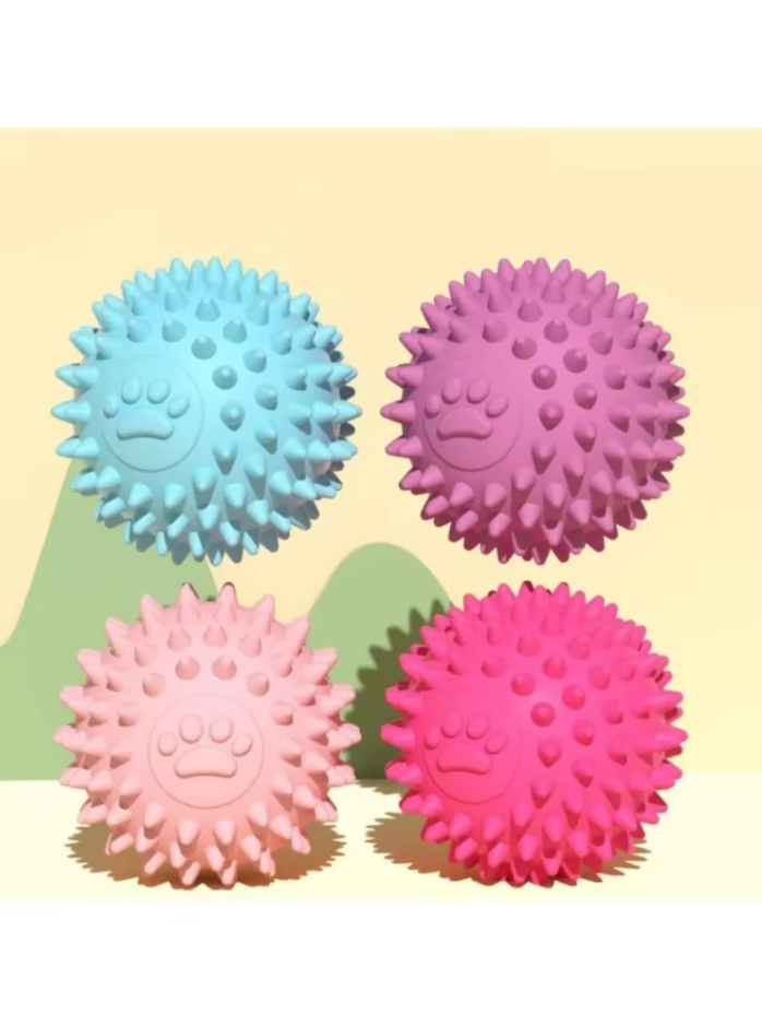 Green textured rubber dog dental chew ball for puppies, promoting healthy teeth and gums.