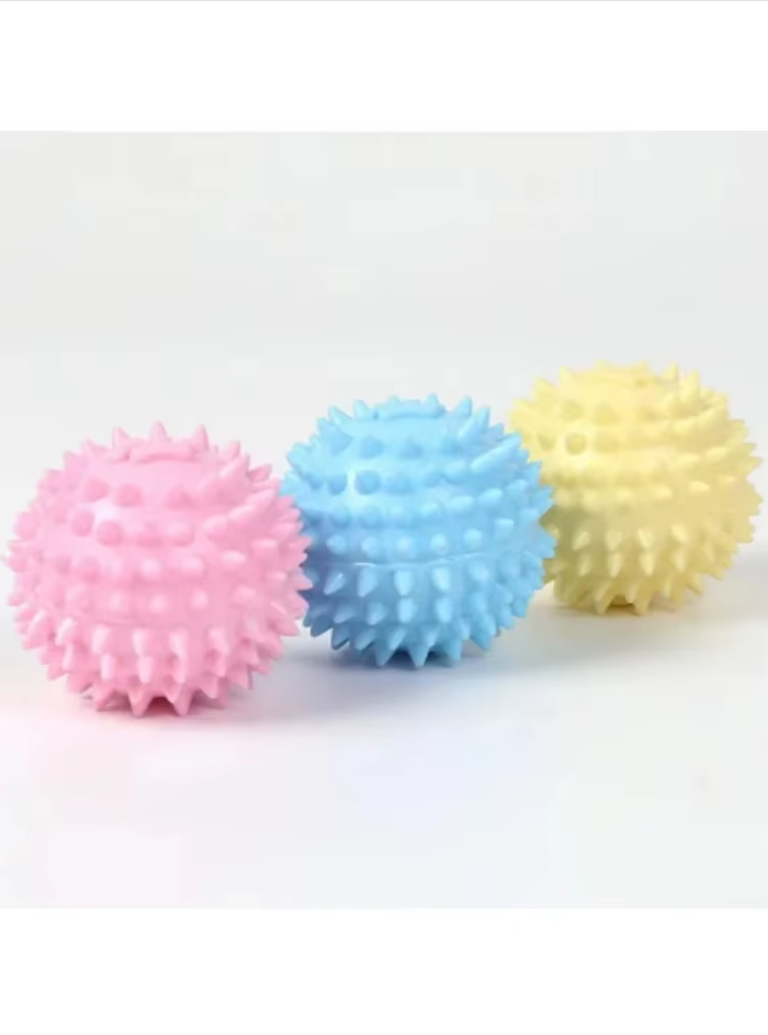 Close-up of a green rubber dental chew ball, showing its texture for effective teeth cleaning.
