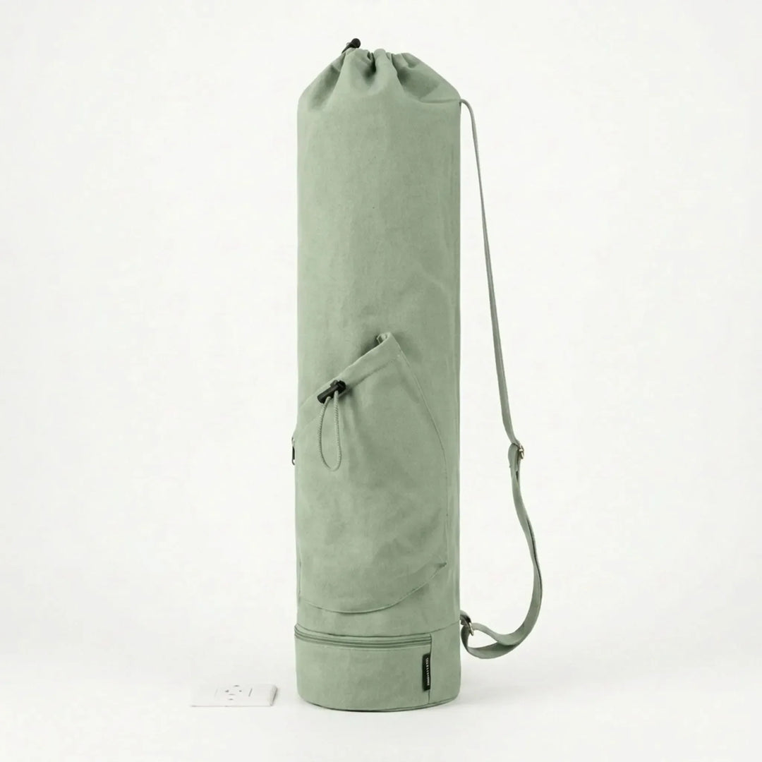 Women's green yoga mat crossbody bag, durable design for secure and easy transport of your mat.