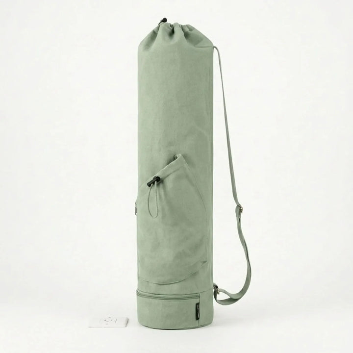 Women's green yoga mat crossbody bag, durable design for secure and easy transport of your mat.