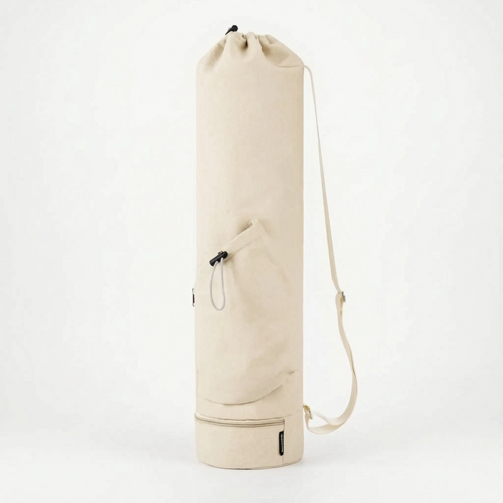 Beige women's yoga mat fitness bag, versatile activewear accessory for yoga, pilates, and gym sessions.