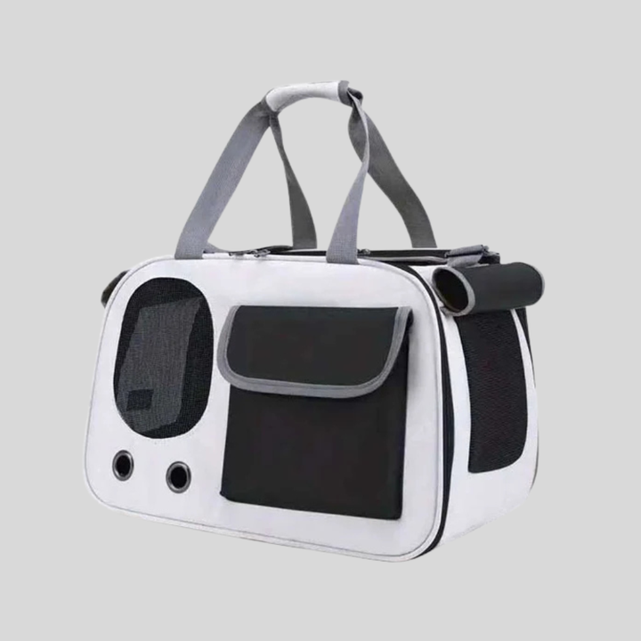 Grey airline approved pet carrier for small dogs and cats, featuring mesh windows and shoulder strap.