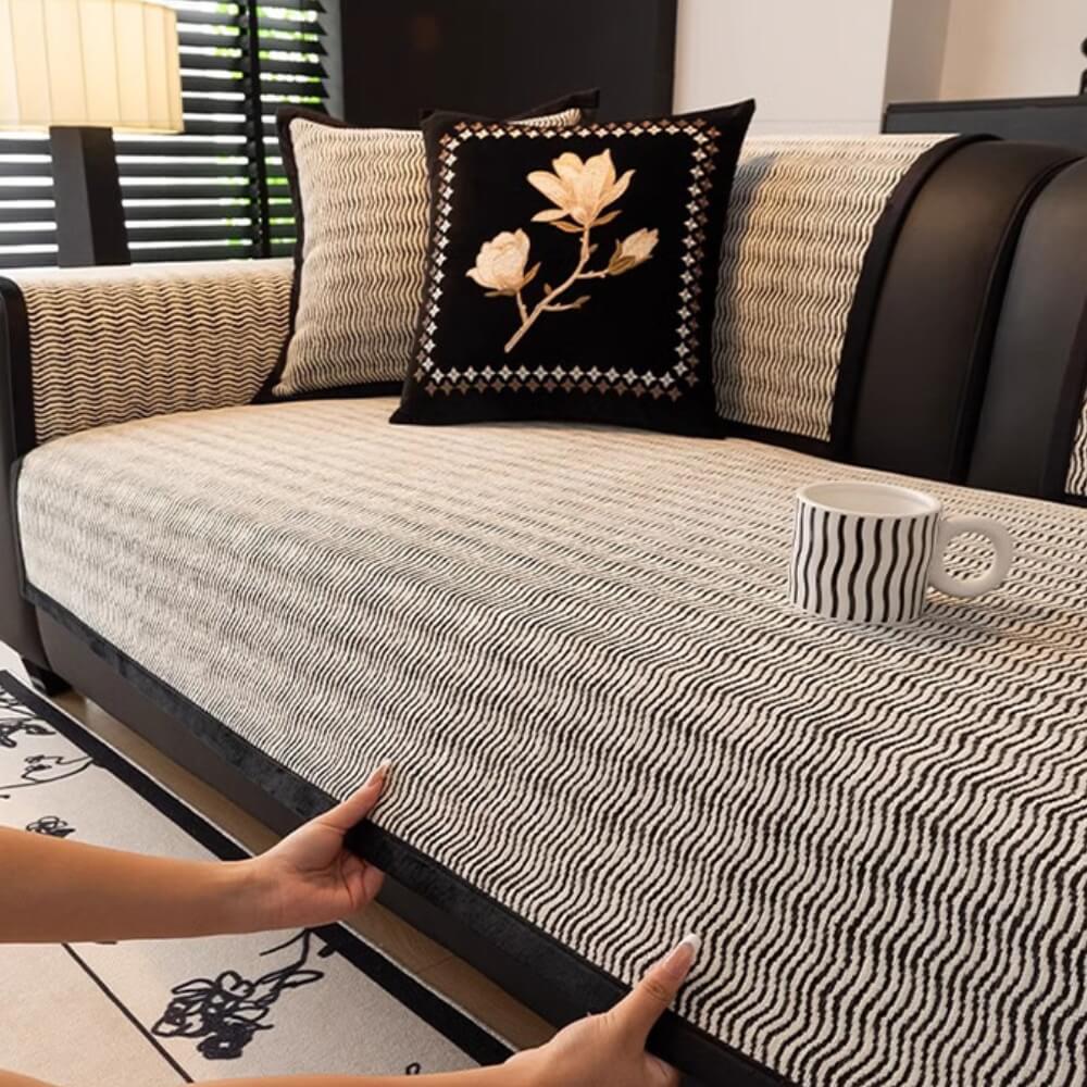 A family living room with a chenille non-slip couch cover providing pet-friendly furniture protection.