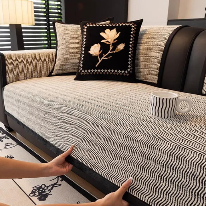 A family living room with a chenille non-slip couch cover providing pet-friendly furniture protection.