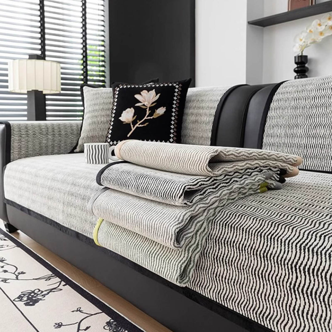 Soft, breathable chenille couch protector in beige, pet-friendly and machine washable for easy care.