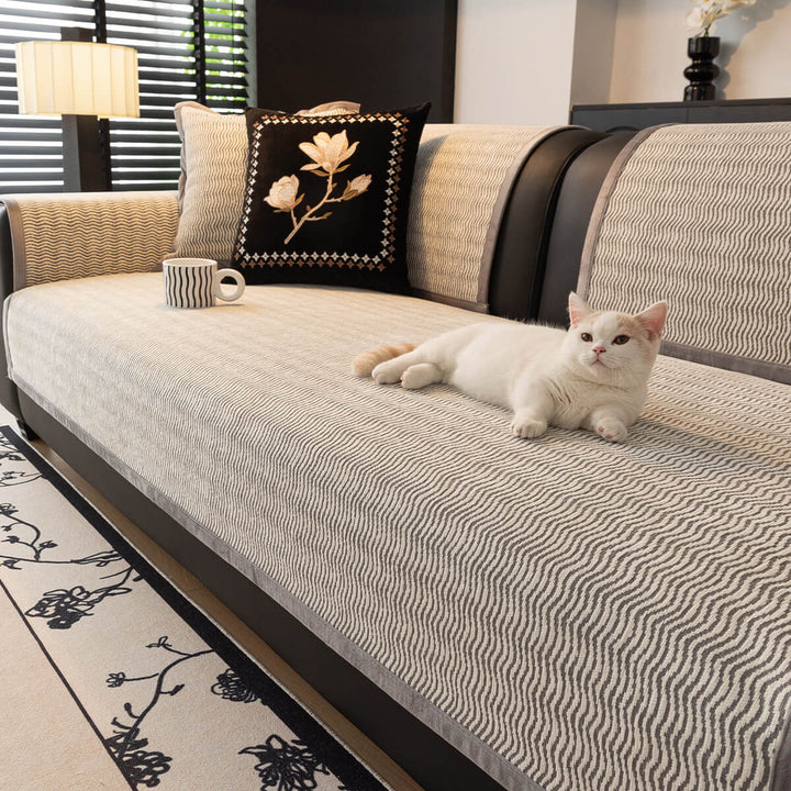 Corner of a sofa showing how the chenille non-slip cover fits securely, protecting from pets.