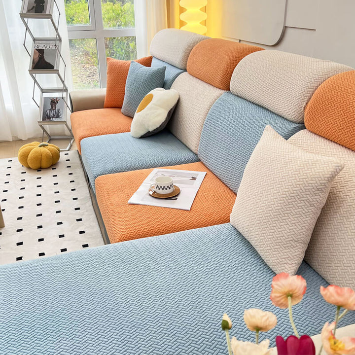 Grey fleece sofa protector for a 3-seater couch, pet-friendly and machine washable home decor.