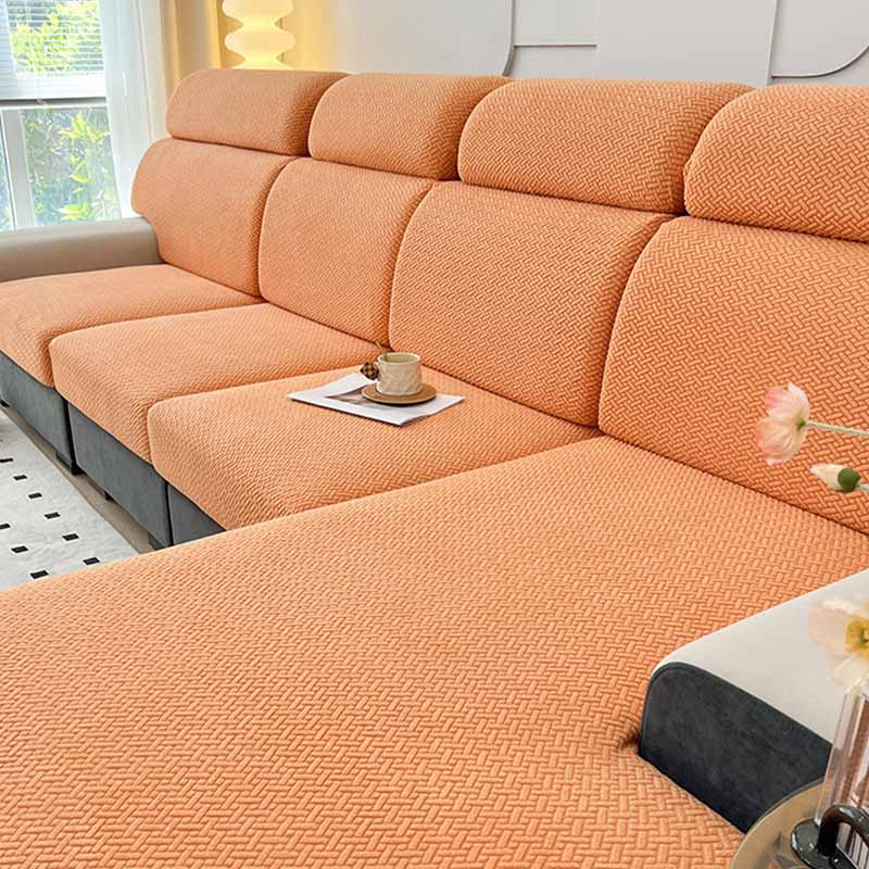 A child and pet friendly fleece couch cover in brown, providing durable furniture protection.