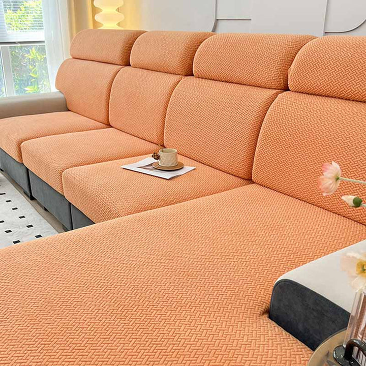 A child and pet friendly fleece couch cover in brown, providing durable furniture protection.