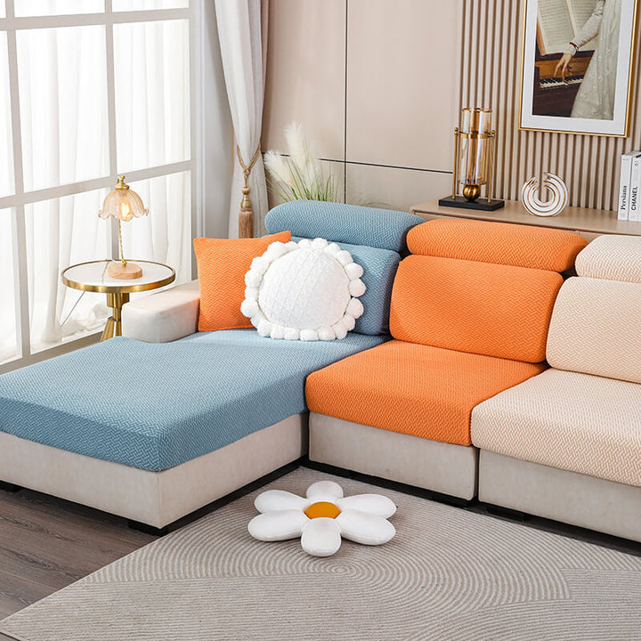 Unisex fleece sofa protector in a modern cream color, enhancing living room aesthetics.
