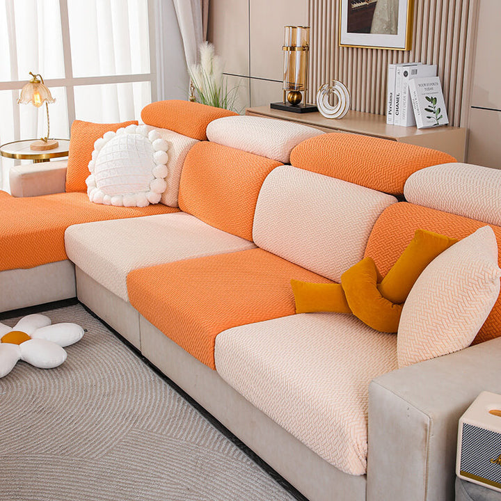 Package shot of the fleece sofa furniture protector, emphasizing its machine washable feature.