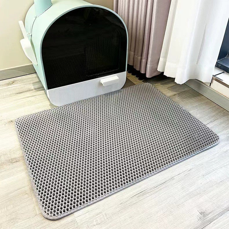 Top-down view of a rectangular pet litter mat, ideal for cat care and household litter control.