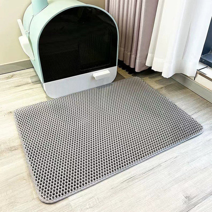 Top-down view of a rectangular pet litter mat, ideal for cat care and household litter control.