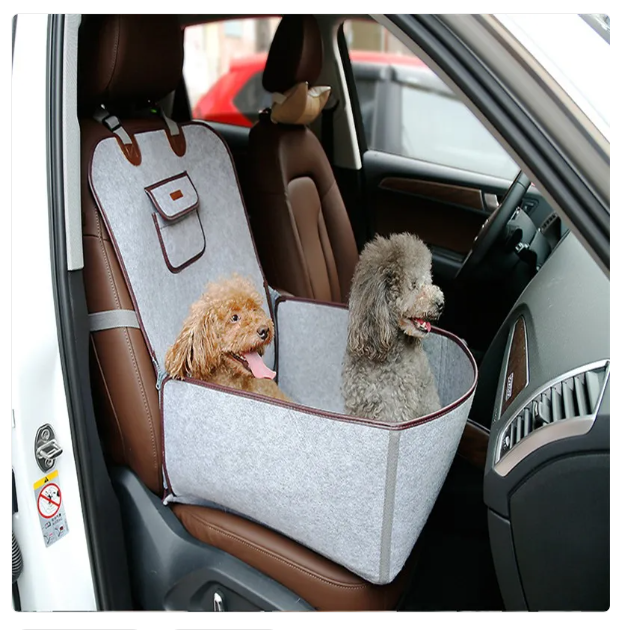 Unisex dog car seat, black fabric with secure strap, essential pet travel accessory.