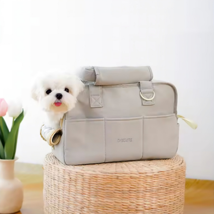 Grey pet travel carrier bag with mesh windows for small dogs and cats, top handle and shoulder strap.