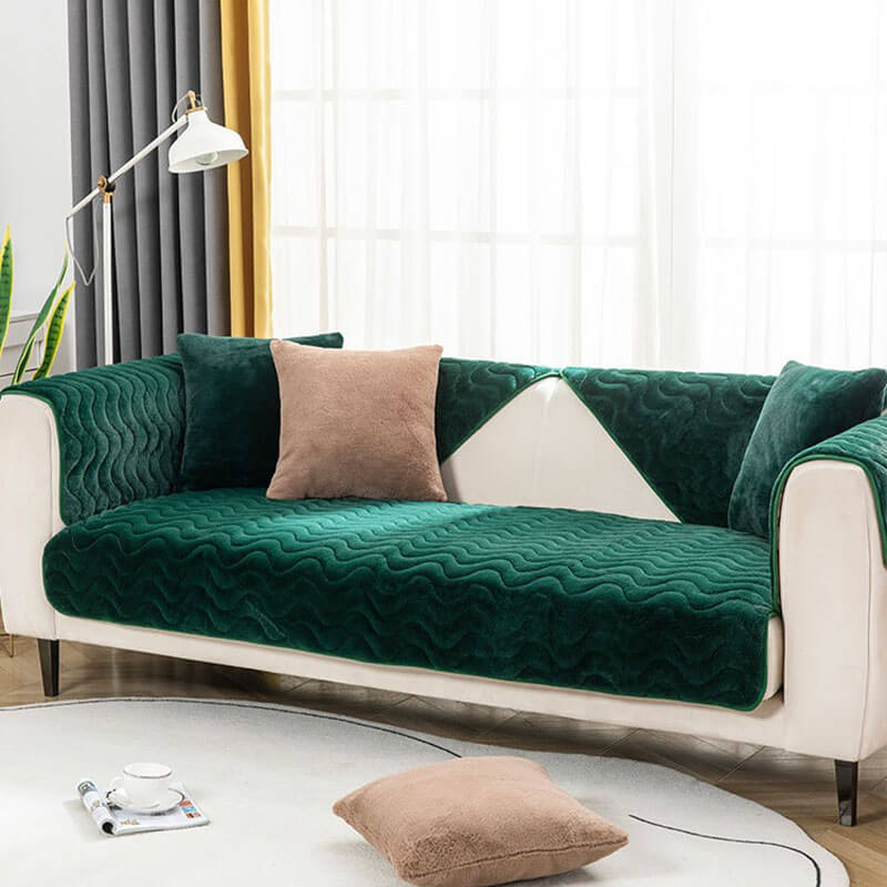 Grey plush sofa cover, showcasing its cozy texture and decorative wave design