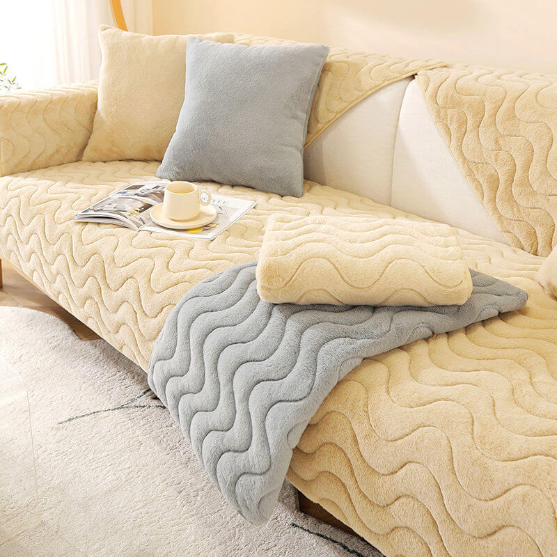 Close-up of wave pattern on a grey plush couch cover, highlighting soft texture
