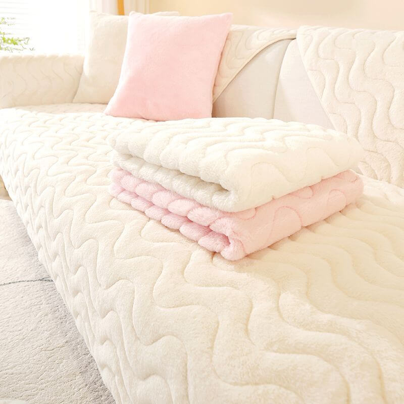 Non-slip backing of a plush sofa cover, showing grip dots for secure fit on furniture