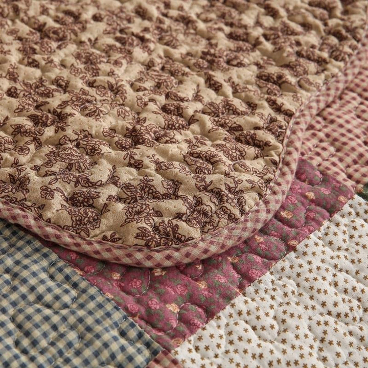 Non-slip backing of a washable quilted cotton sofa cover, ensuring furniture stability and protection.