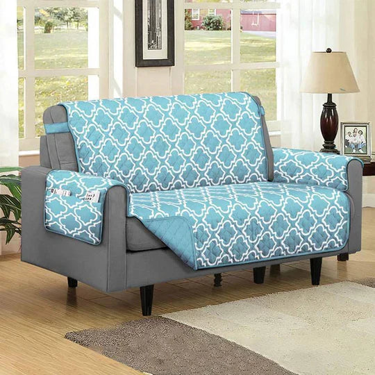 Child and pet playing on a cream-colored sofa protected by a spill-proof slipcover
