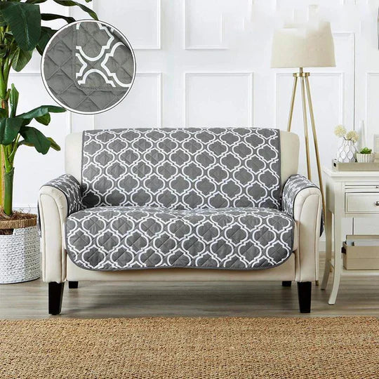 Detailed stitching on a green sofa protective cover, high-quality furniture slipcover